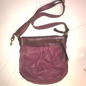 Maroon leather Fossil purse.  11” x 10”.